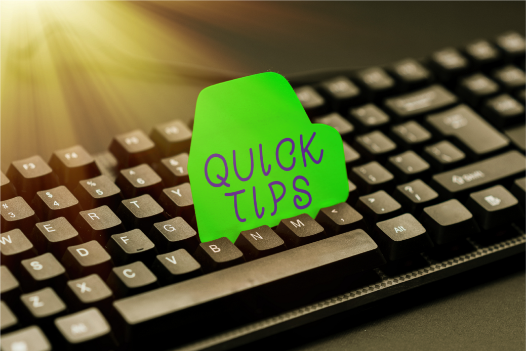 A black keyboard and over it stands a green note that is written Quick tips as a reminder.